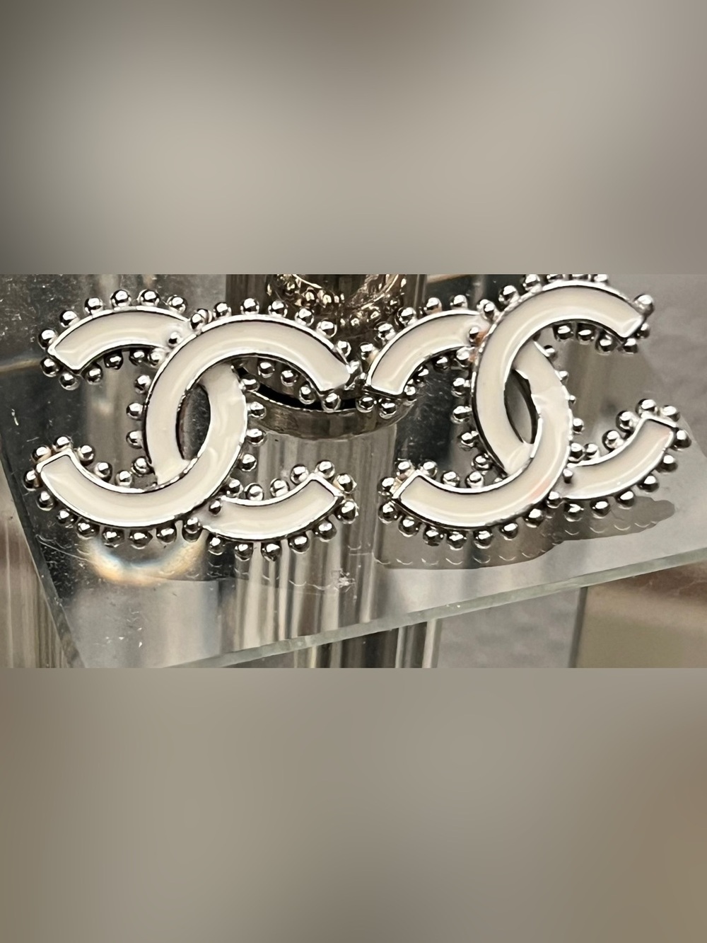 White acrylic inspired iconic logo earrings. Beautiful & Pristine